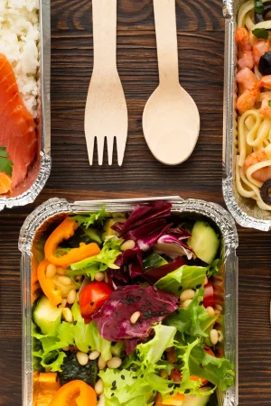 flat-lay-arrangement-with-different-meals-wooden-table